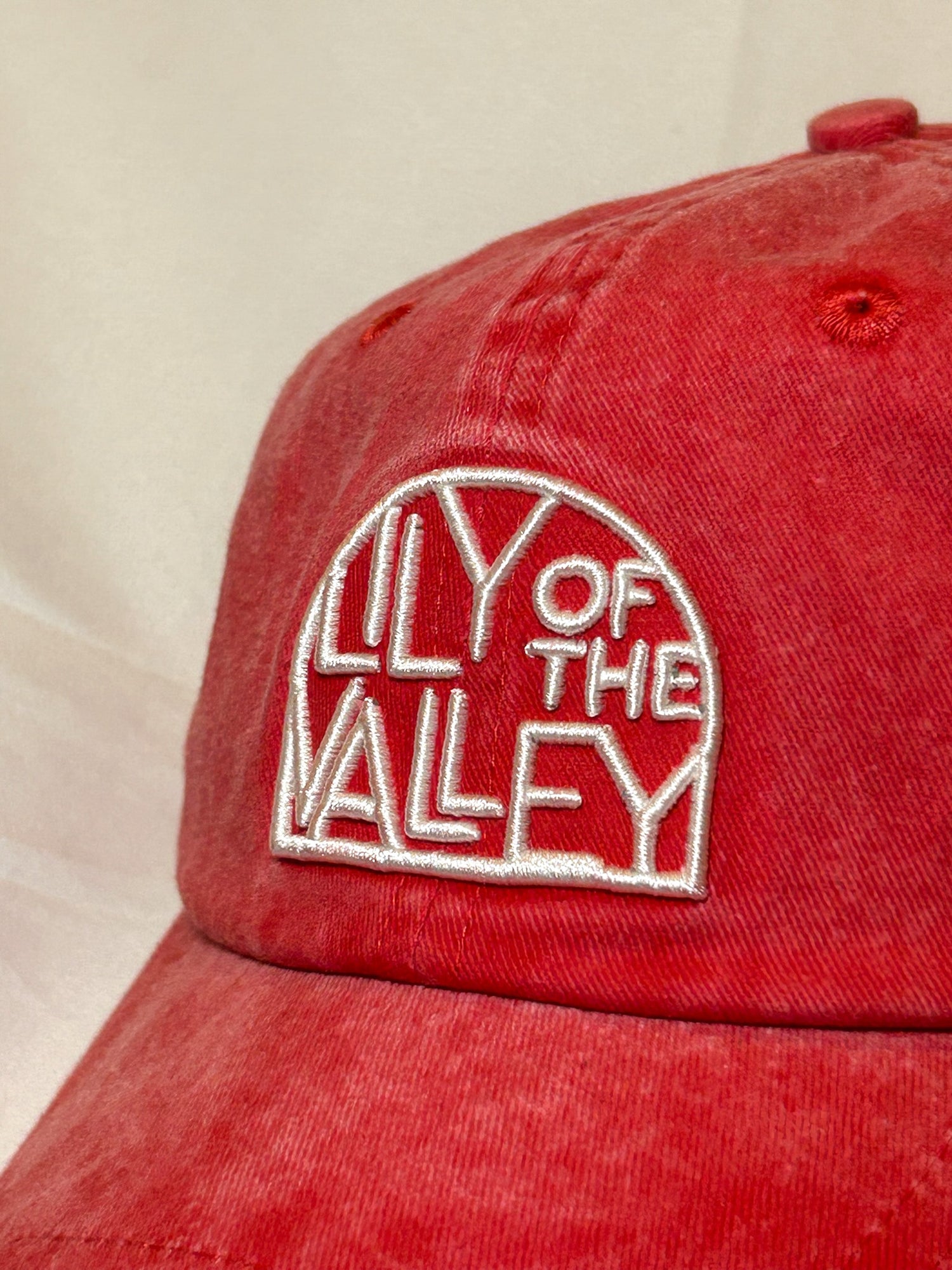 Faded red baseball cap
