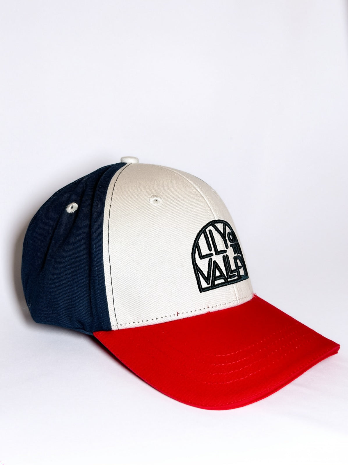 Blue, white, and red canvas cap